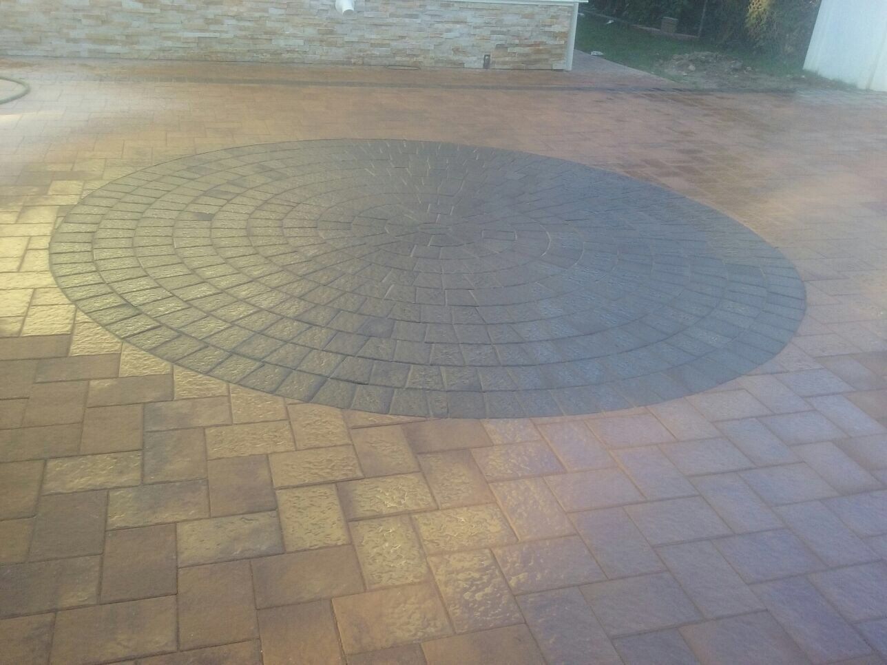 Brick paver with black circle bricks