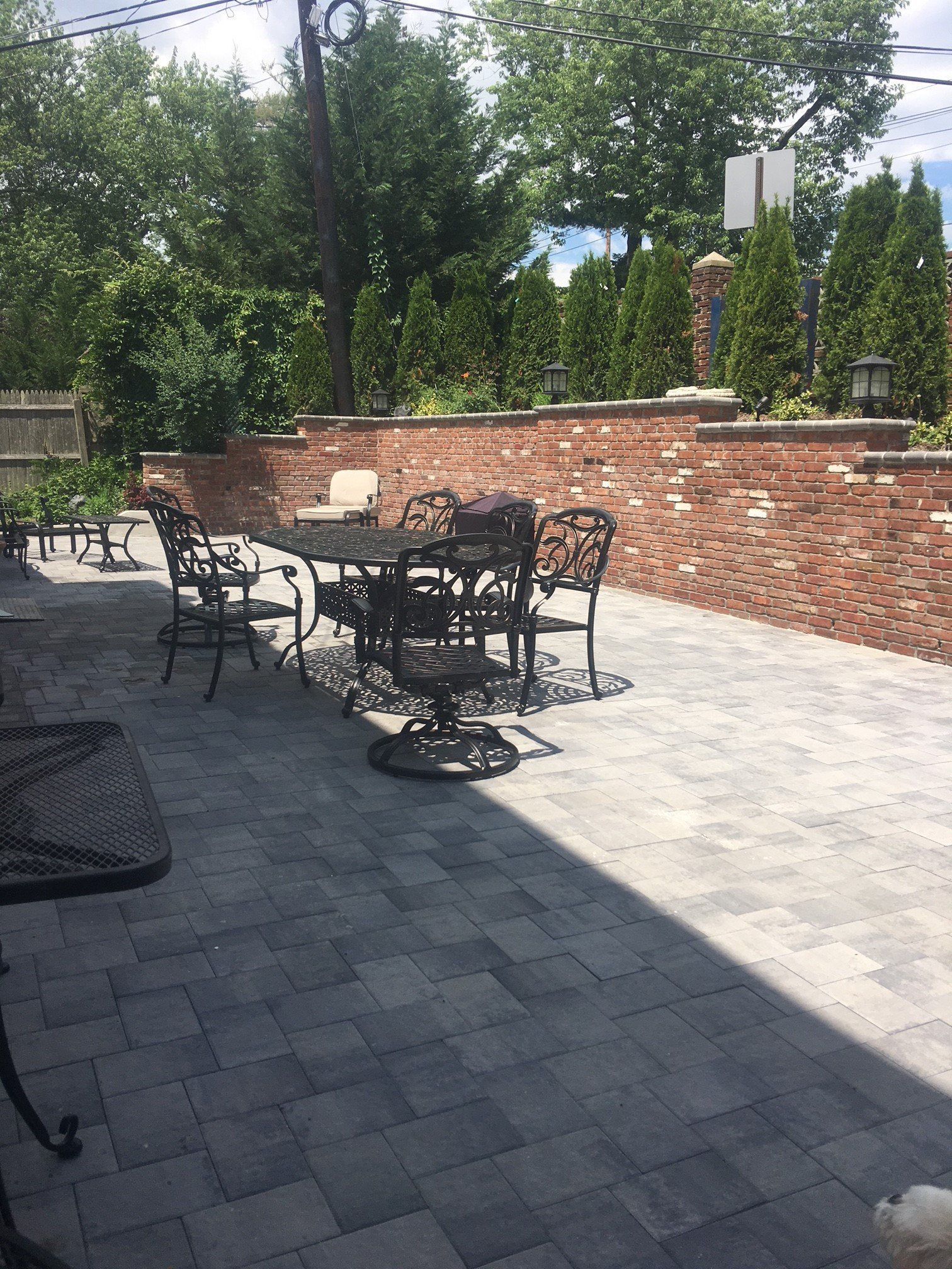 a patio with a table and chairs
