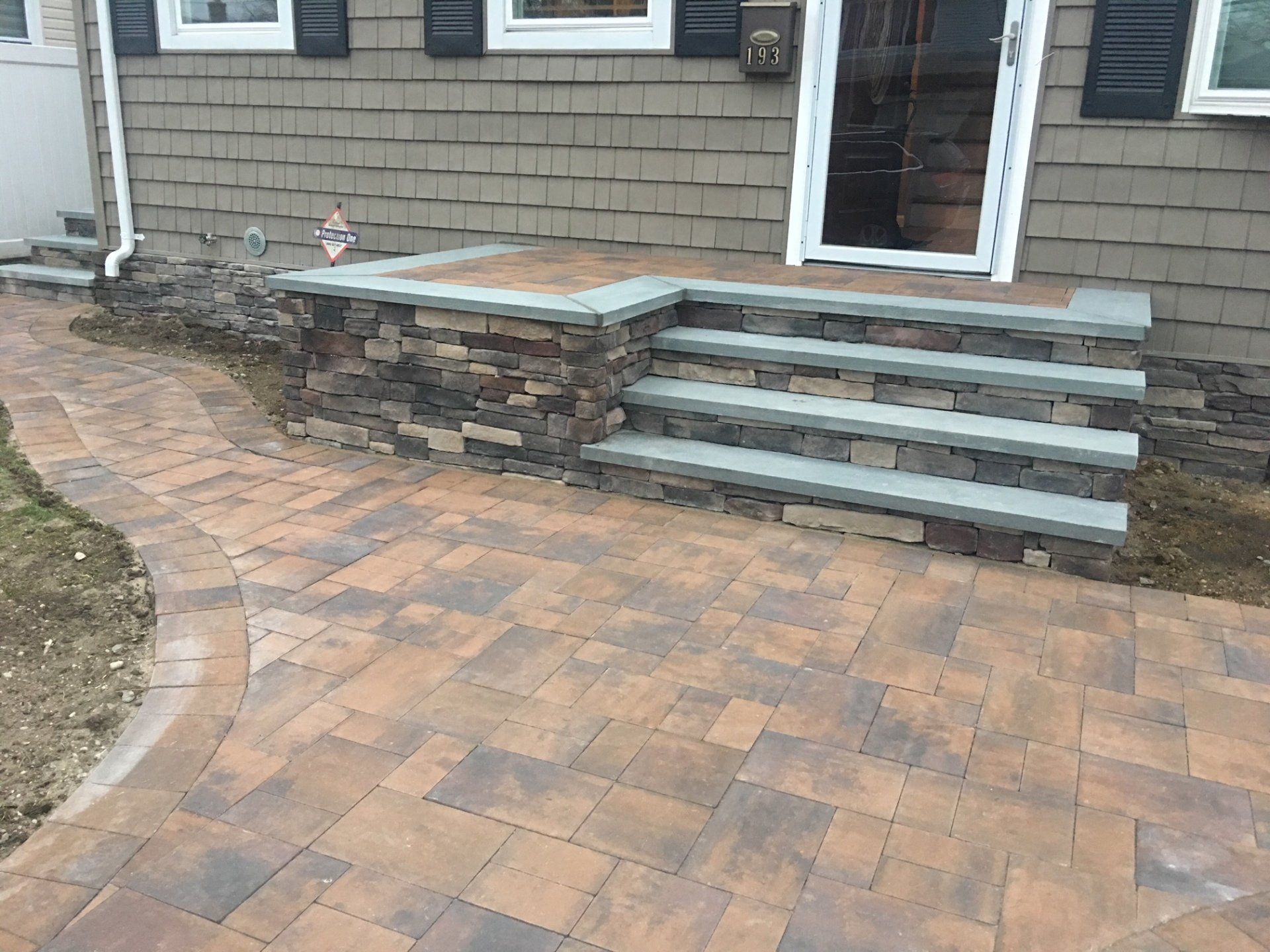 Brick patio with house steps
