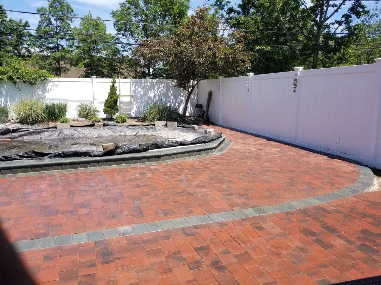 Red brick paver driveway leading.