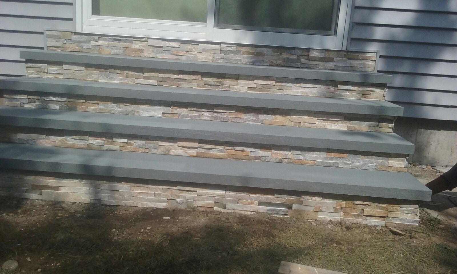 A set of stone steps leading up to a house