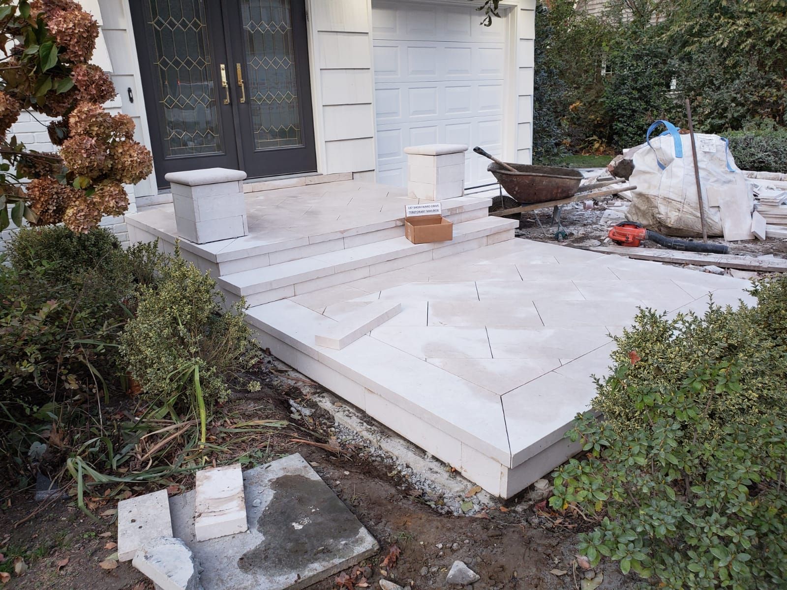 A porch is being built in front of a house.