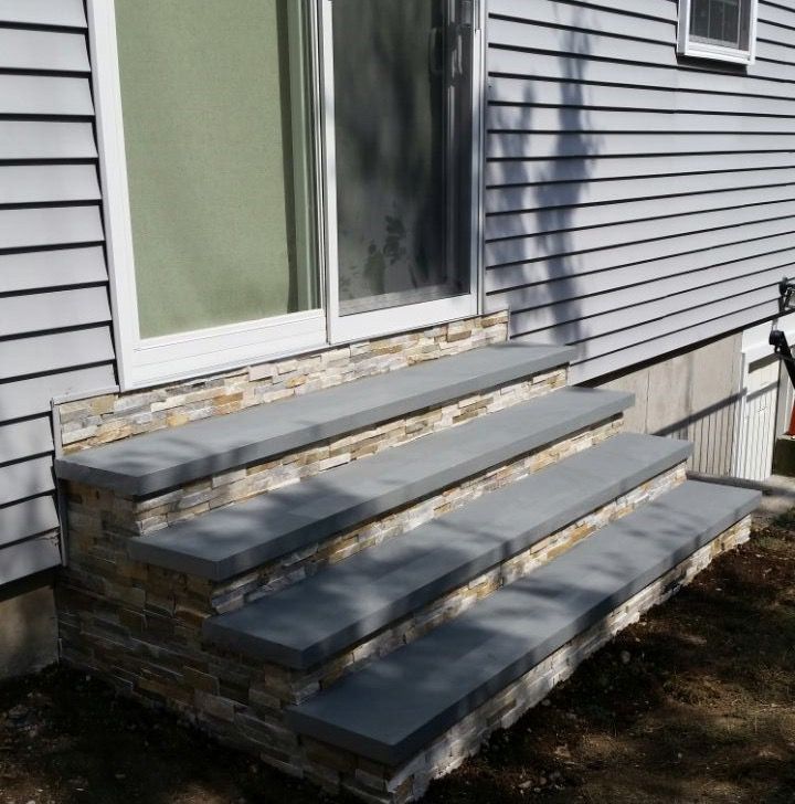 A set of stone steps leading up to a house