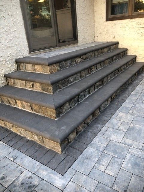 A set of stone steps leading up to a house.