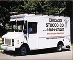 A white truck is parked on the side of the road.