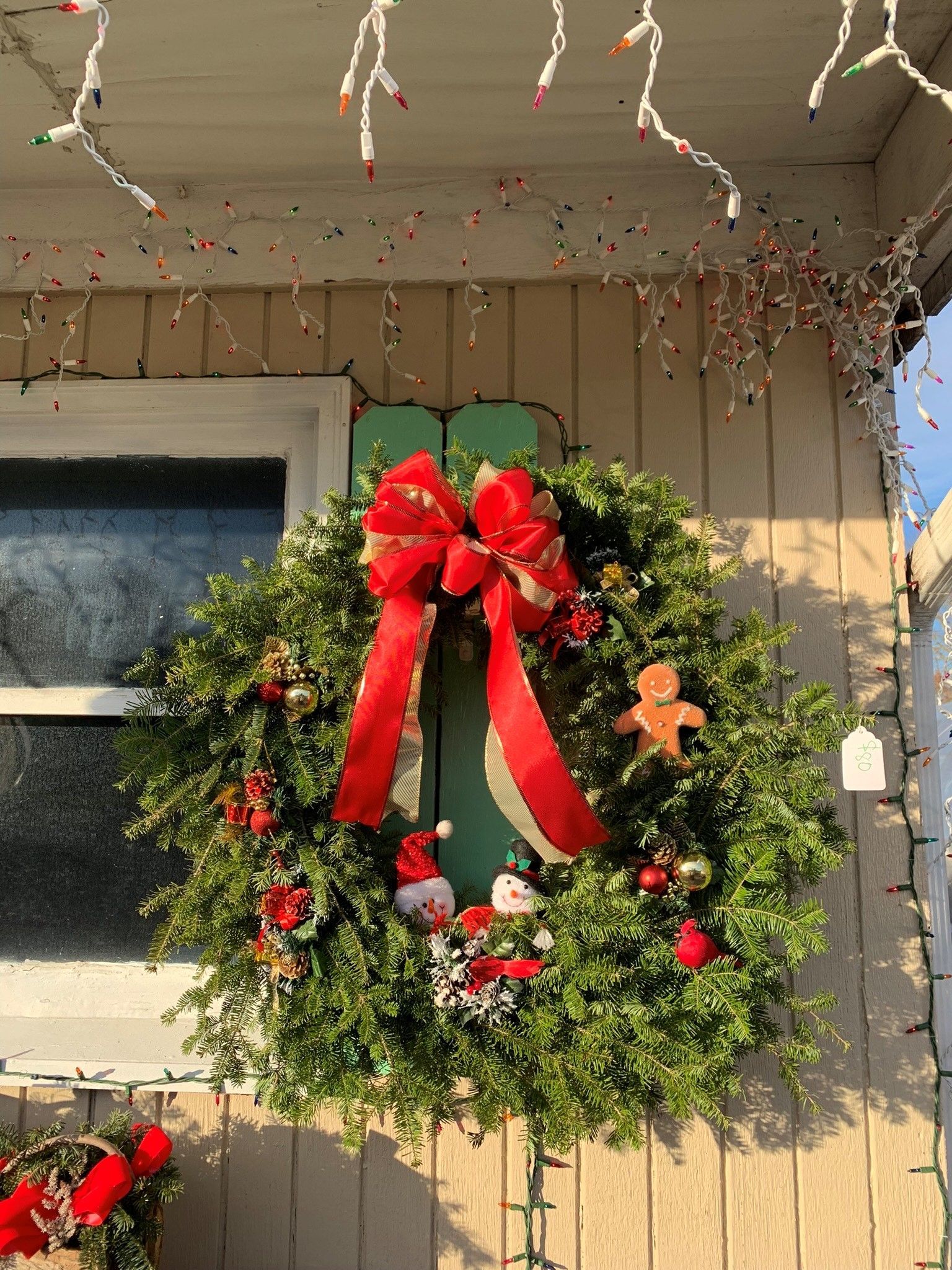 Wreath with red ribbon and Christmas decorations