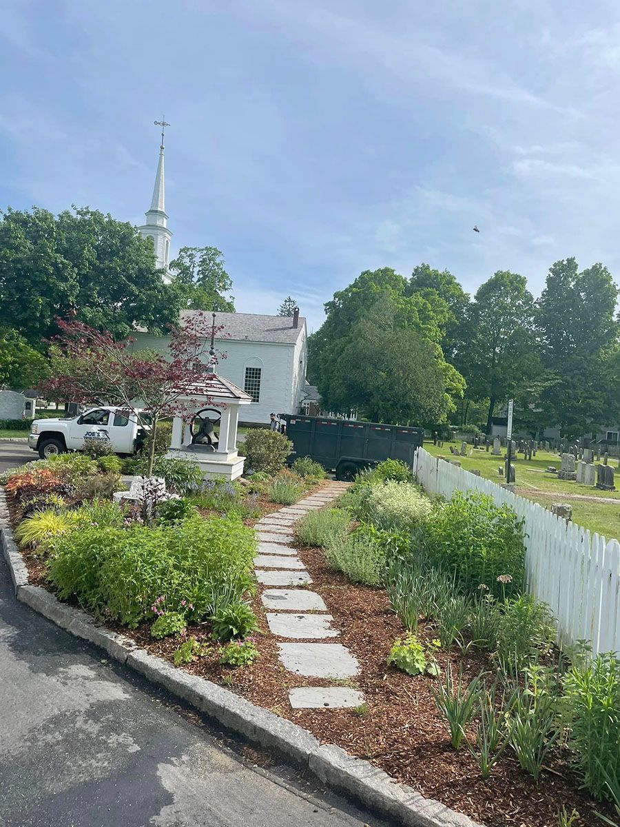 There is a church in the background and a path leading to it