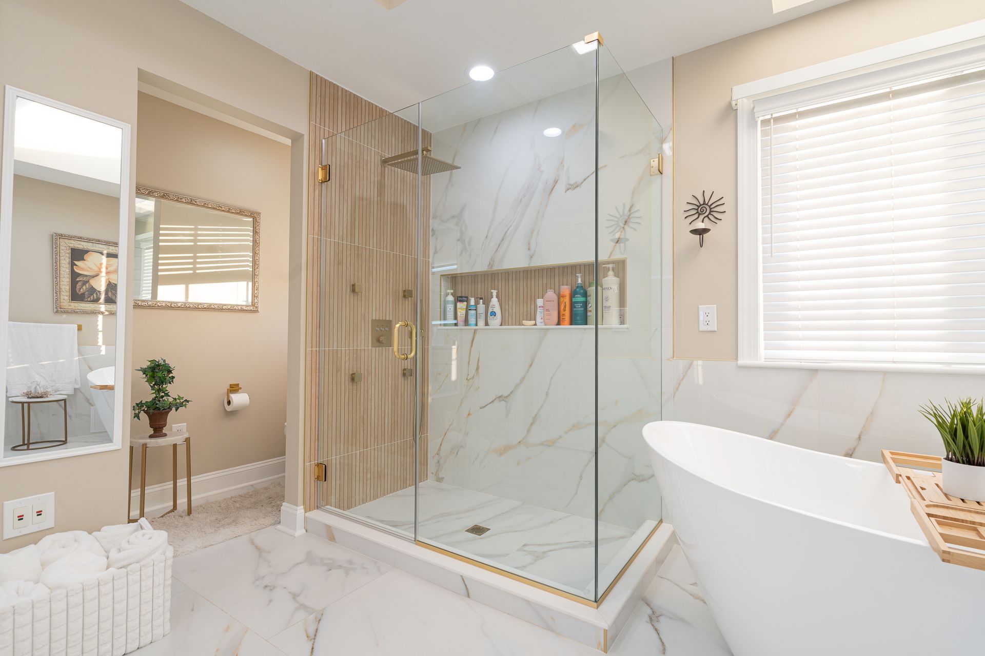 A bathroom with a walk in shower and a bathtub.