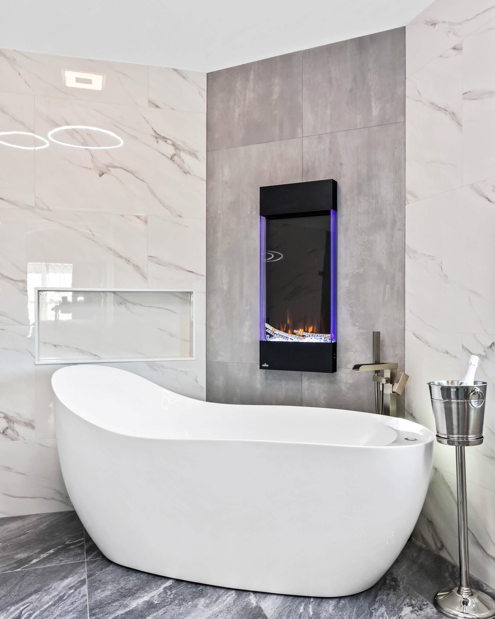 A bathroom with a bathtub and a fireplace.