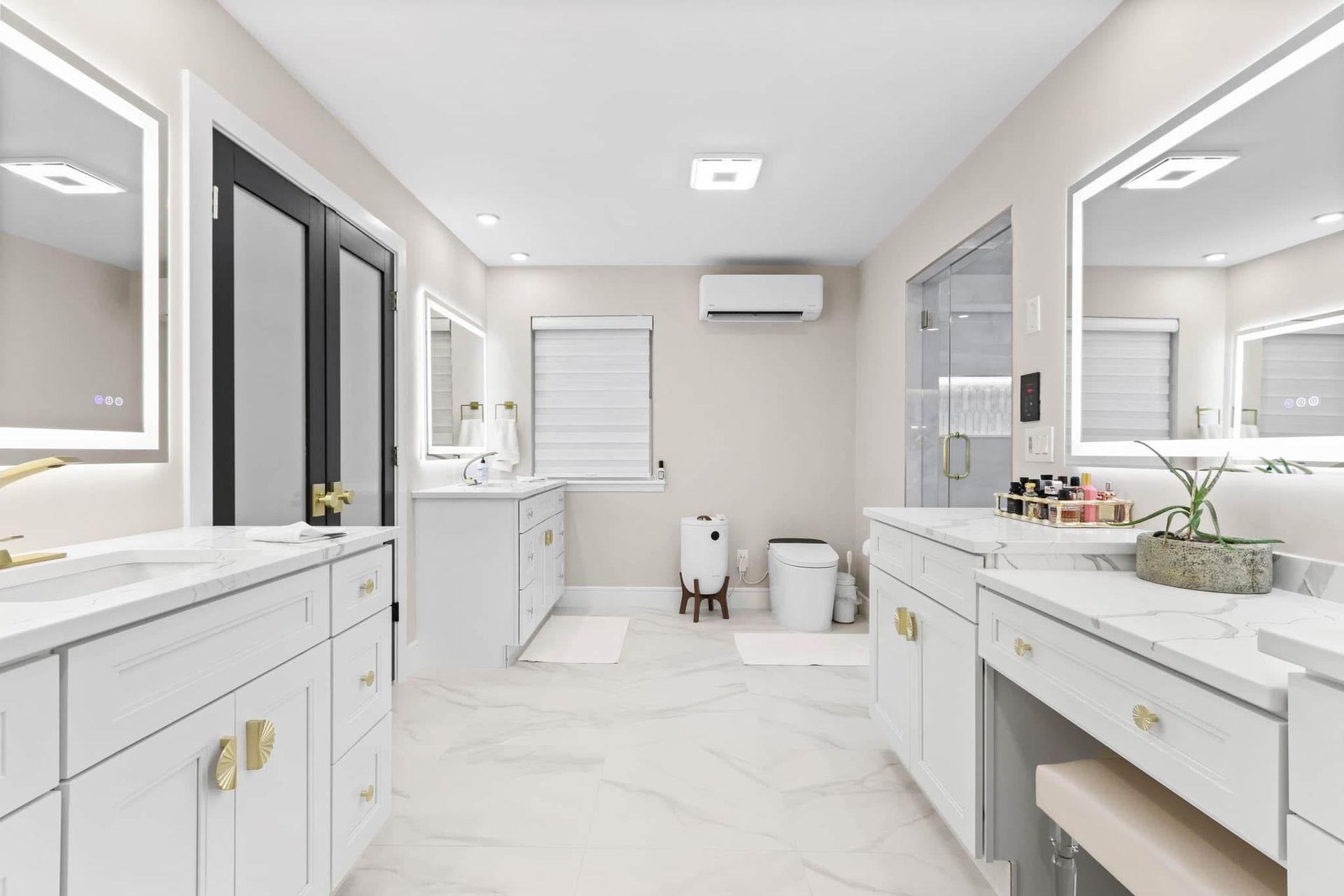 A bathroom with two sinks and two mirrors.