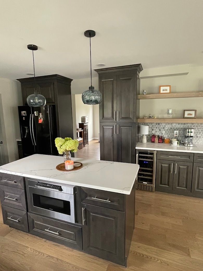 A kitchen with a large island in the middle of it.