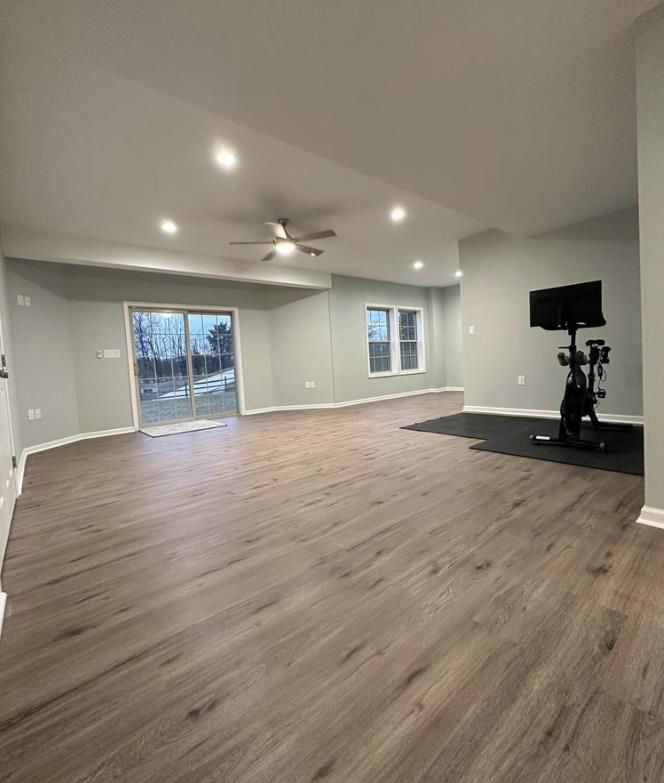 A basement with hardwood floor