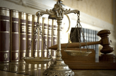scale-of-justice-and-books-on-table