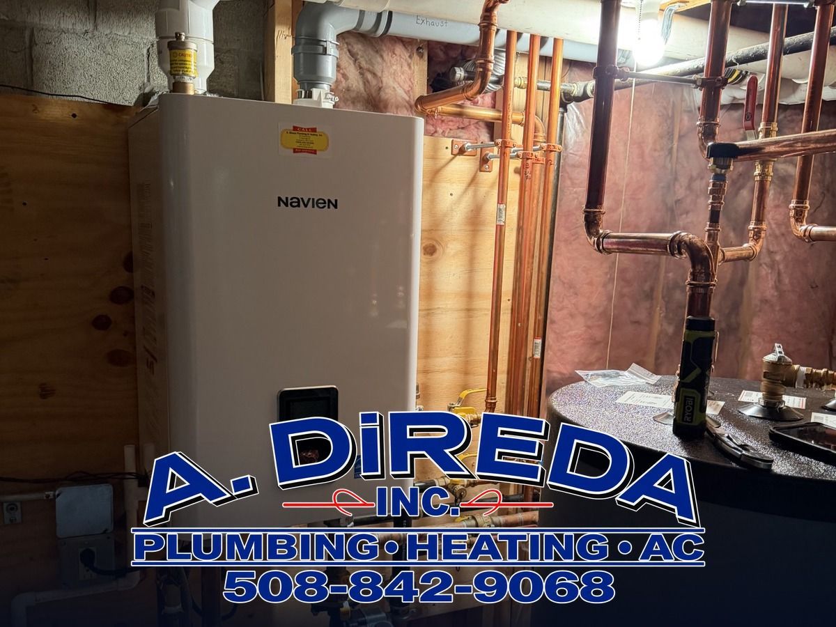 Water heater and exposed plumbing in a basement utility area