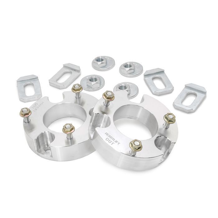a pair of aluminum lift kits with nuts and washers on a white background .