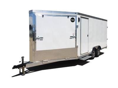 A white trailer is parked