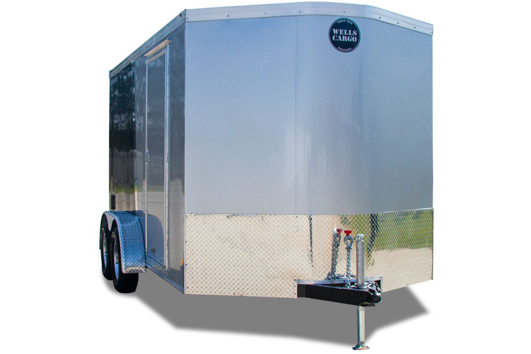 A silver trailer is parked