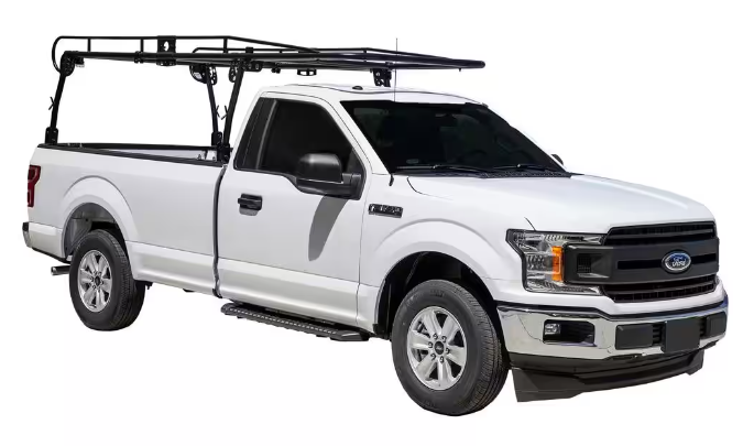 a white truck with a roof rack on top of it