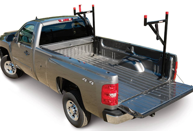 a silver pickup truck with a ladder rack in the bed