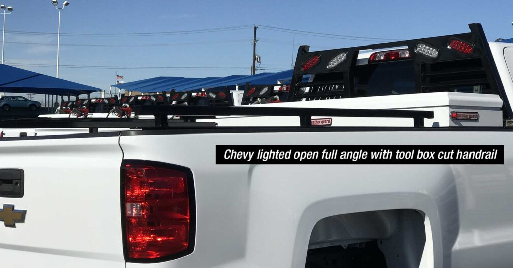 a white truck with a bumper sticker with white toolbox car handrail
