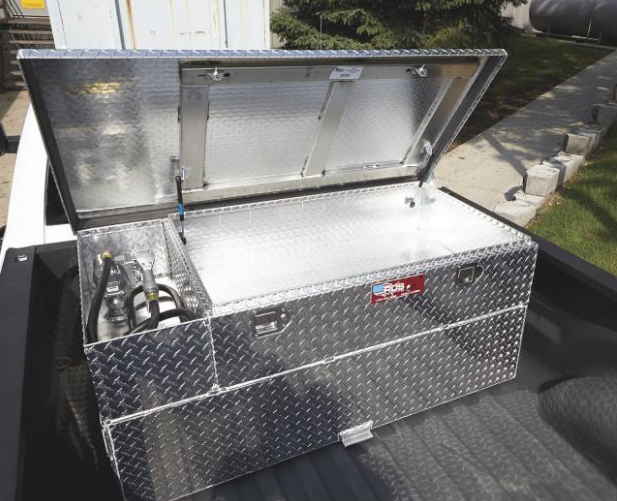 an aluminum toolbox is sitting in the back of a truck with the lid open