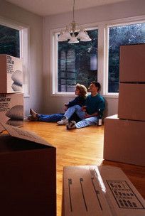 The man and the woman sitting on the floor