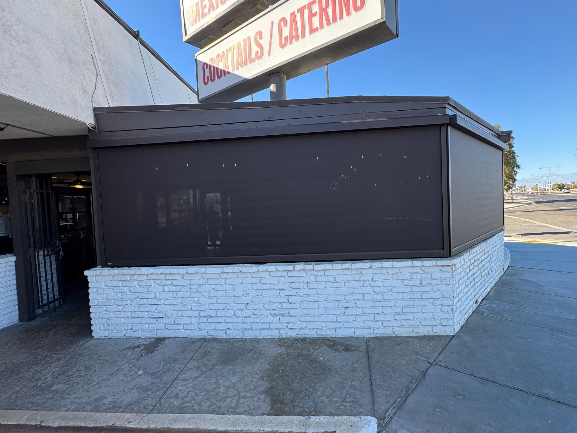 A restaurant with a sign that says cocktails and catering