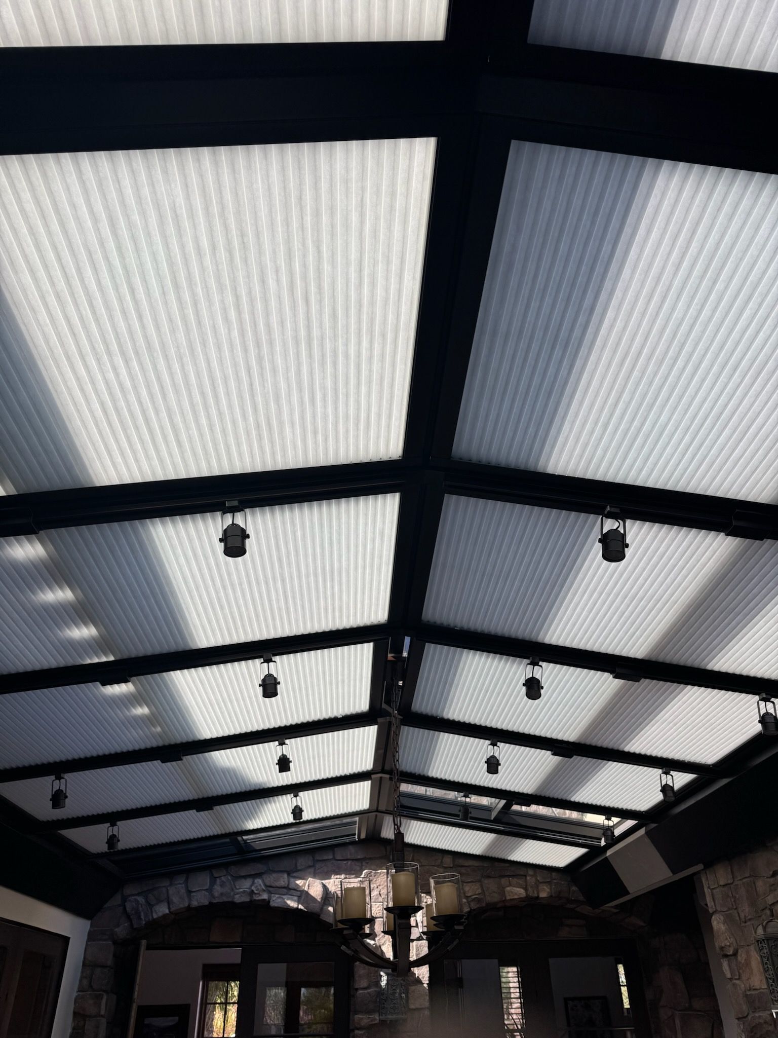 It looks like a ceiling with a lot of lights hanging from it.