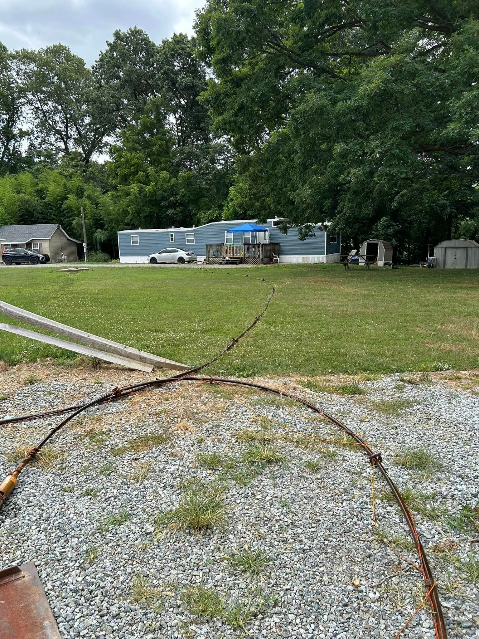 There is a pipe in the middle of a grassy field.