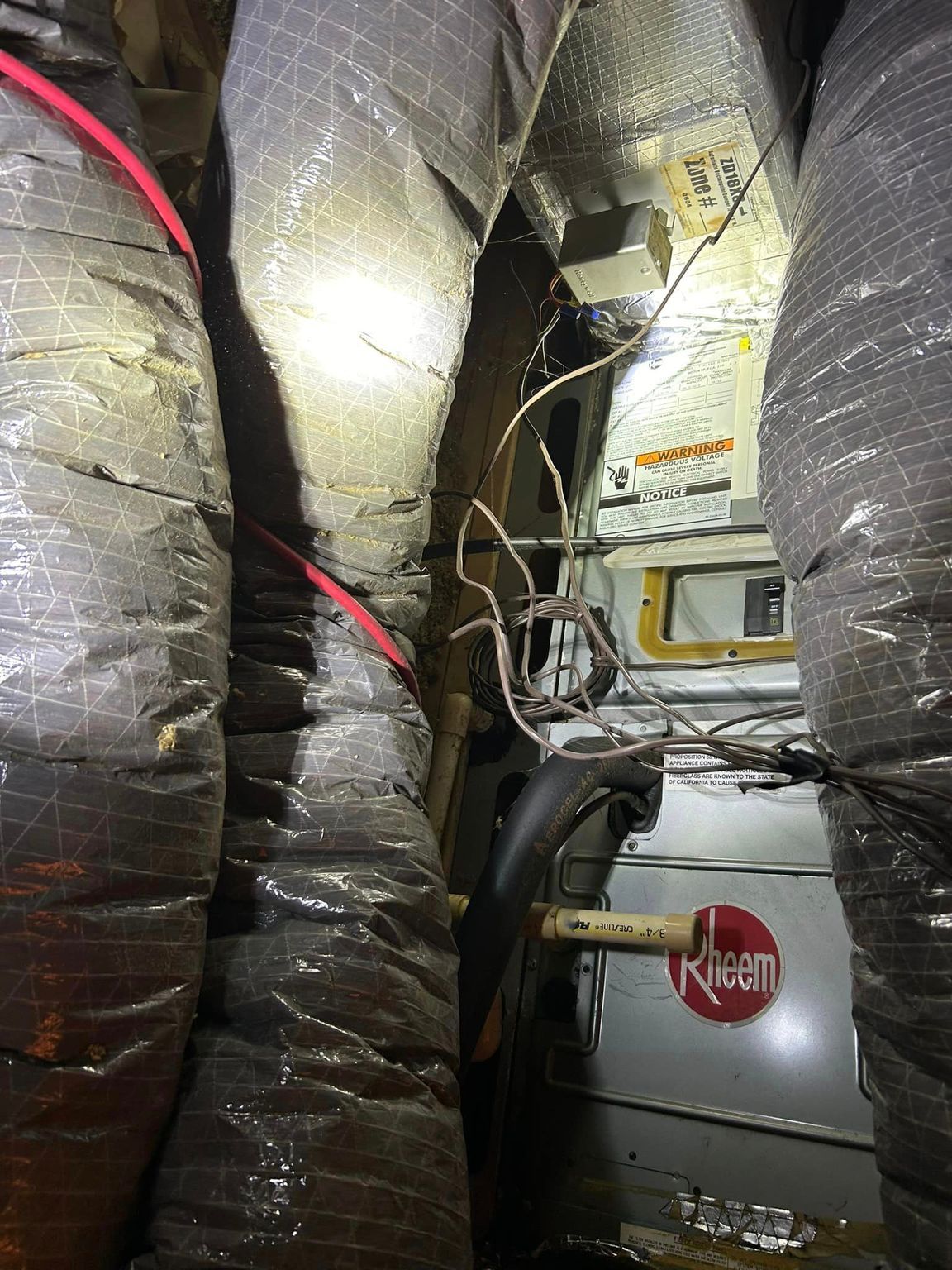 A bunch of pipes are connected to each other in a room.