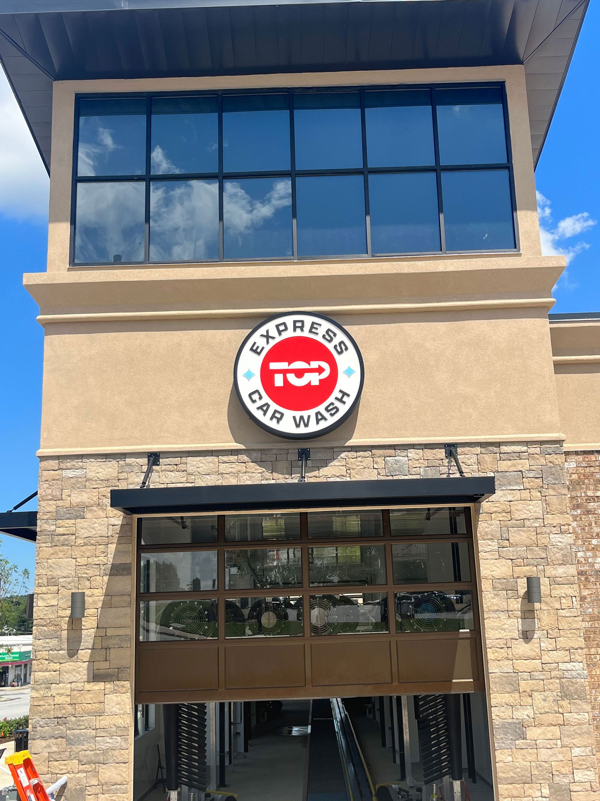 A large building with a sign that says top express car wash