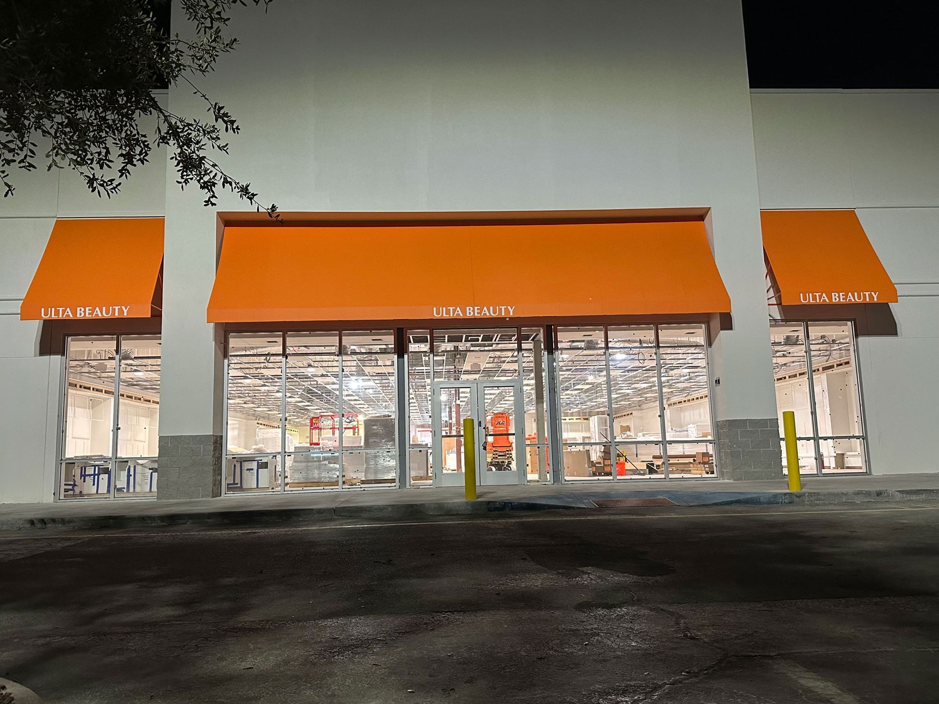 The front of a home depot store with orange awnings