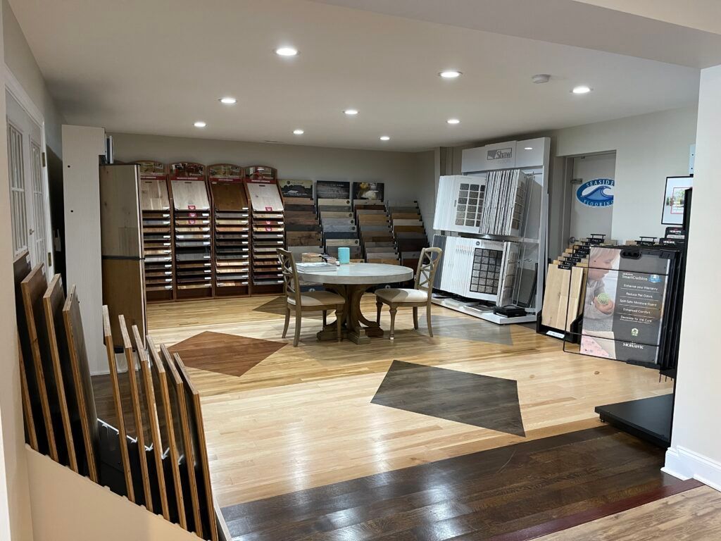 There is a table and chairs in the middle of the room.