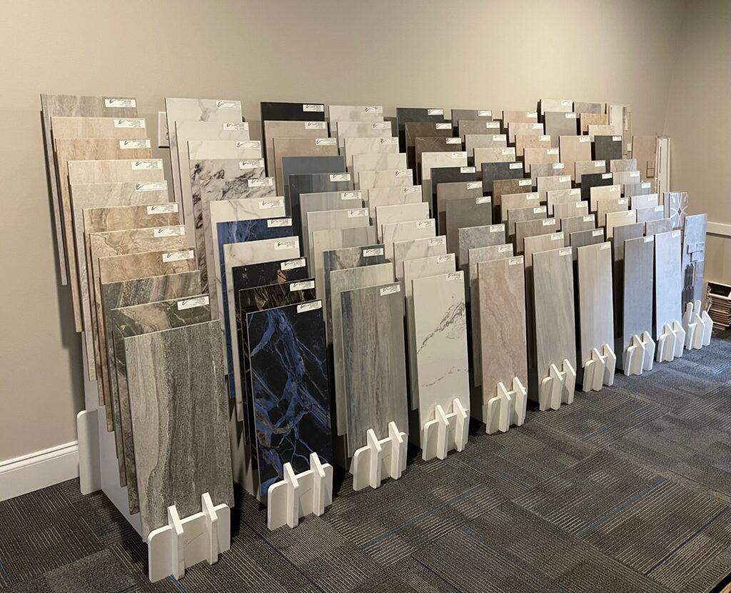 A display of tiles is sitting on a carpet in a room.