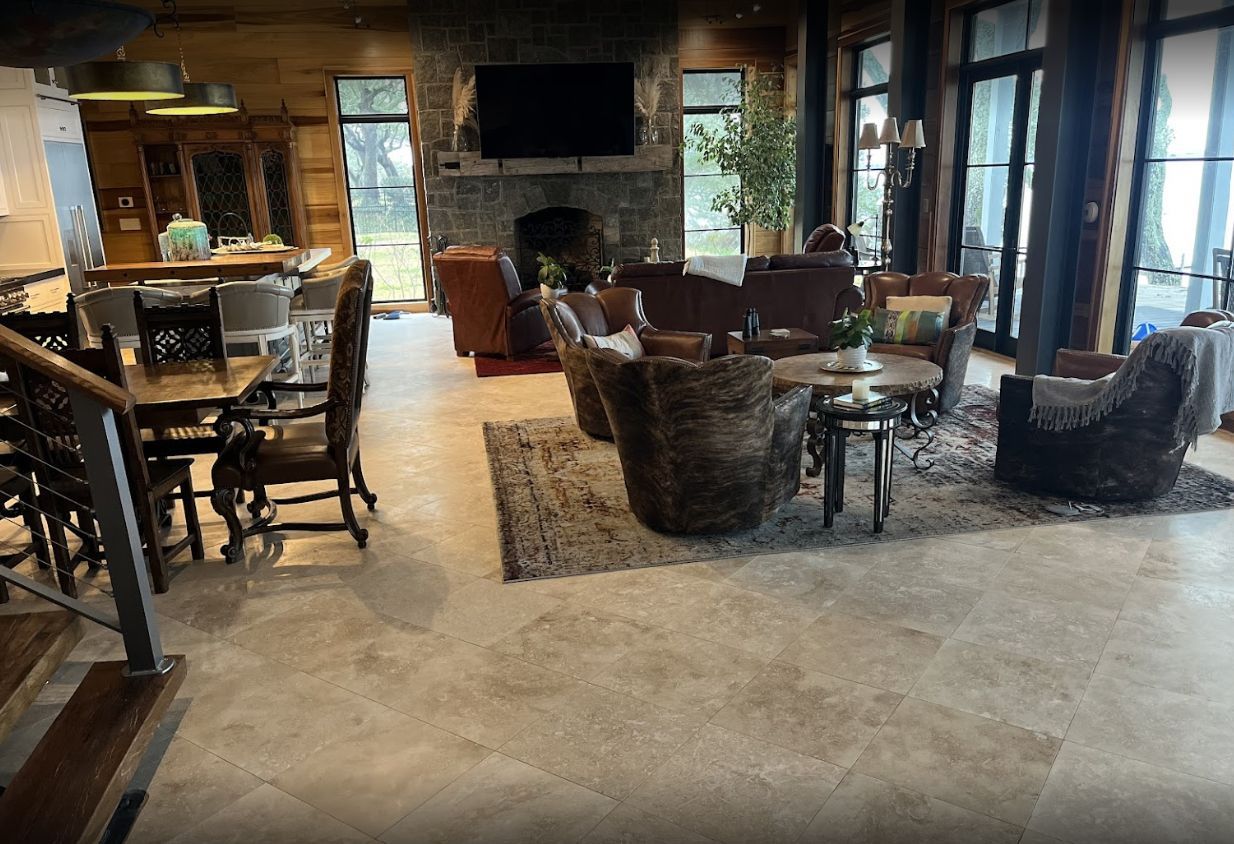 A living room filled with furniture and a fireplace.