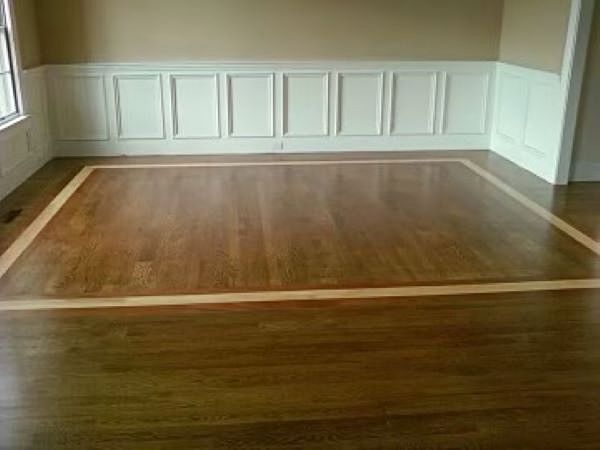 There is a wooden floor in the middle of the room.