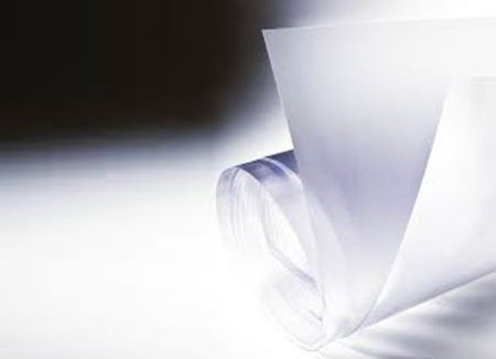 White rolled paper sheets on a light background