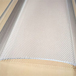 Close-up of a beige woven fabric or mesh surface stretched over a frame