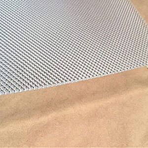 Close-up of a beige surface next to a gray woven fabric texture