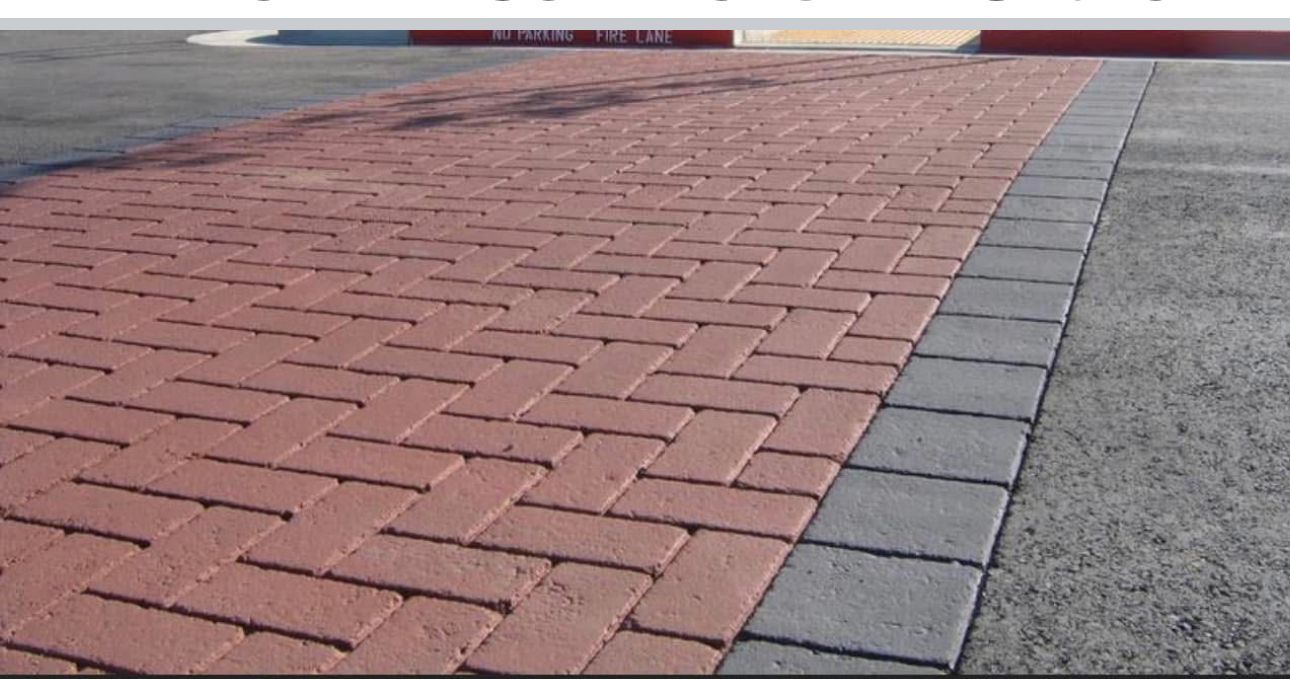 A red brick walkway with a gray border