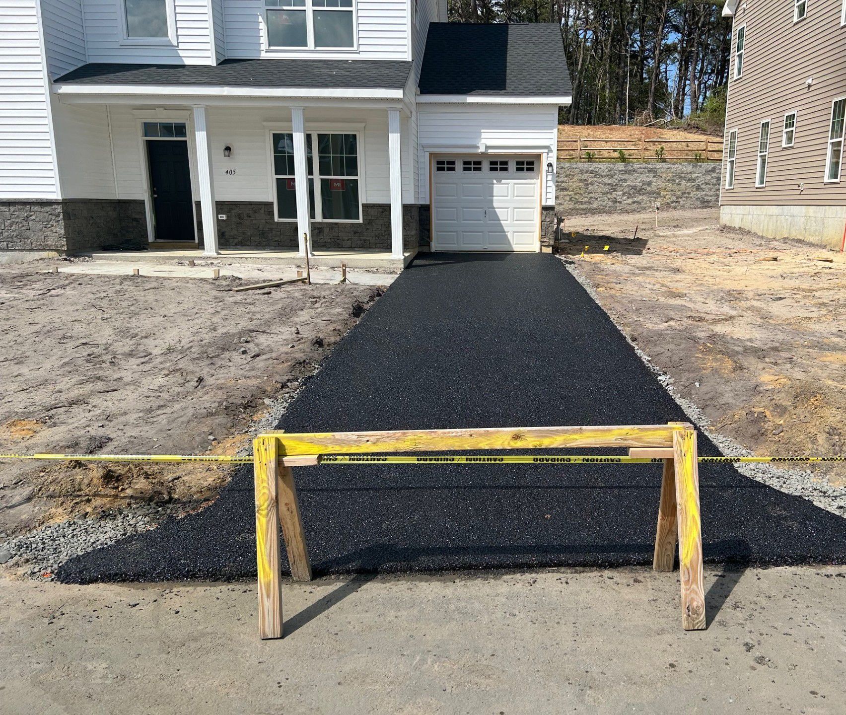 A driveway is being built in front of a house