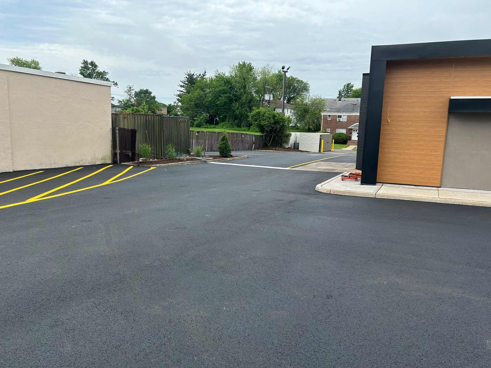 A parking lot with a building in the background.