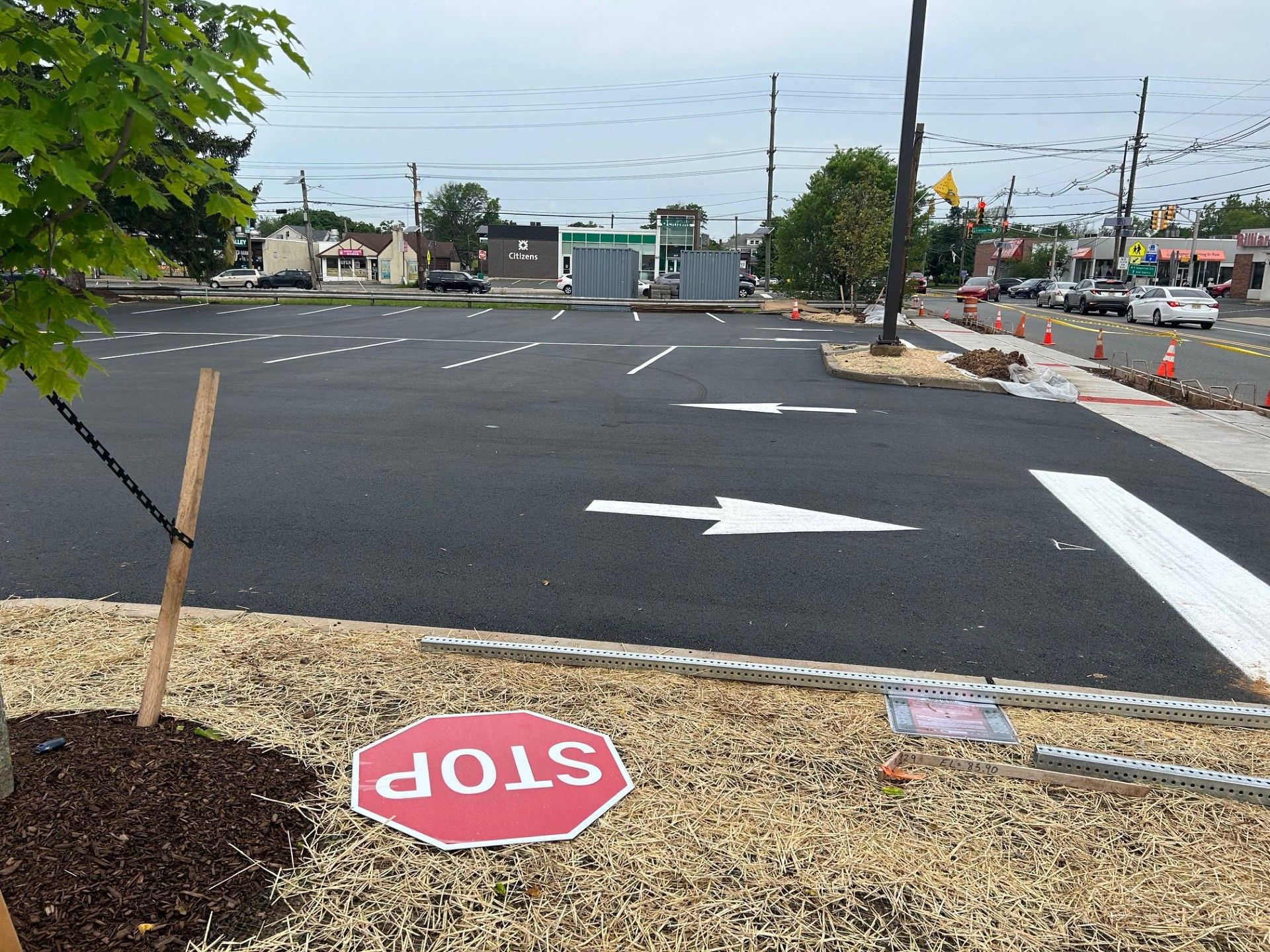 A stop sign is painted on the side of the road.