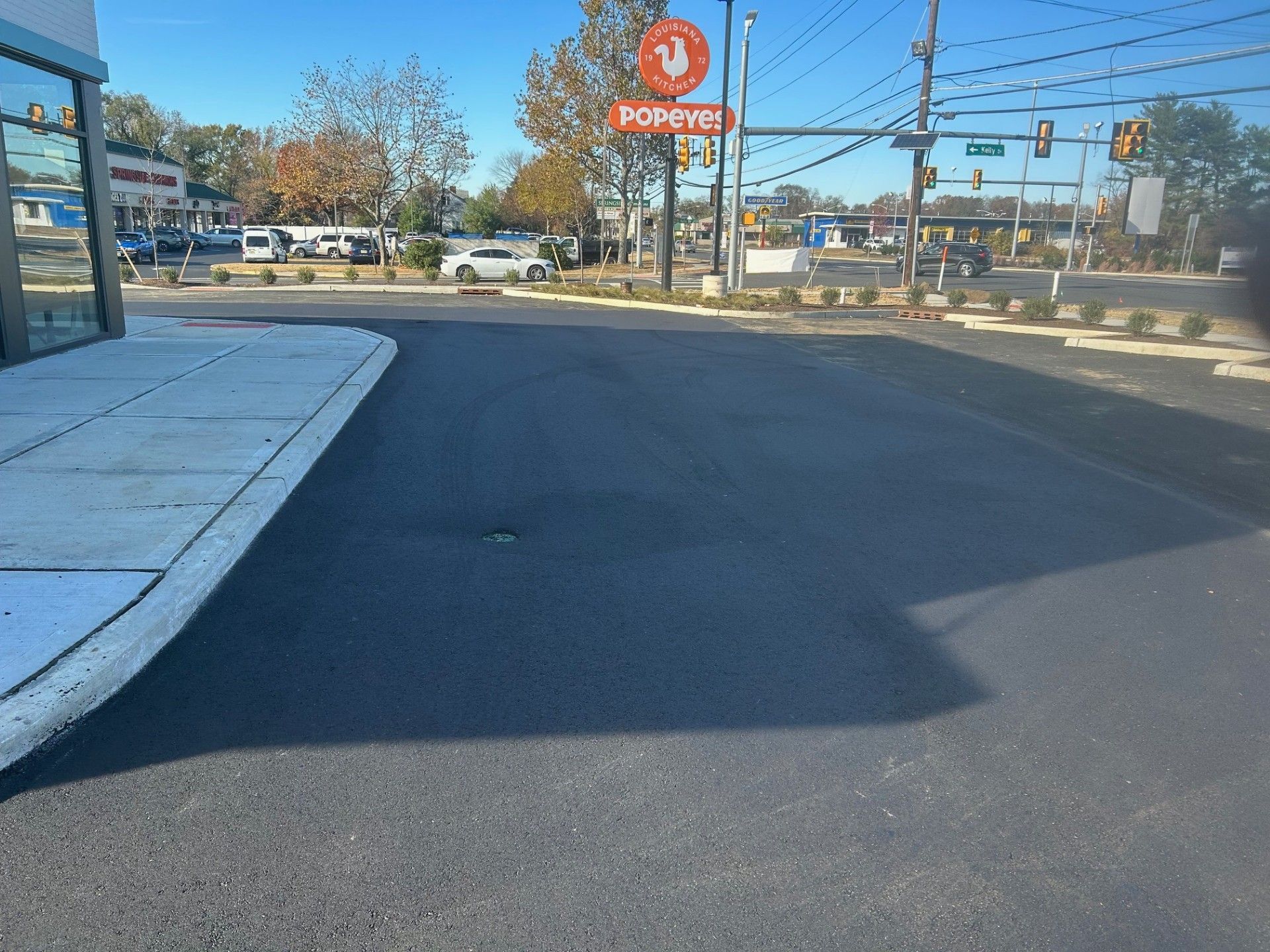 A street with a Popeye's sign on it.