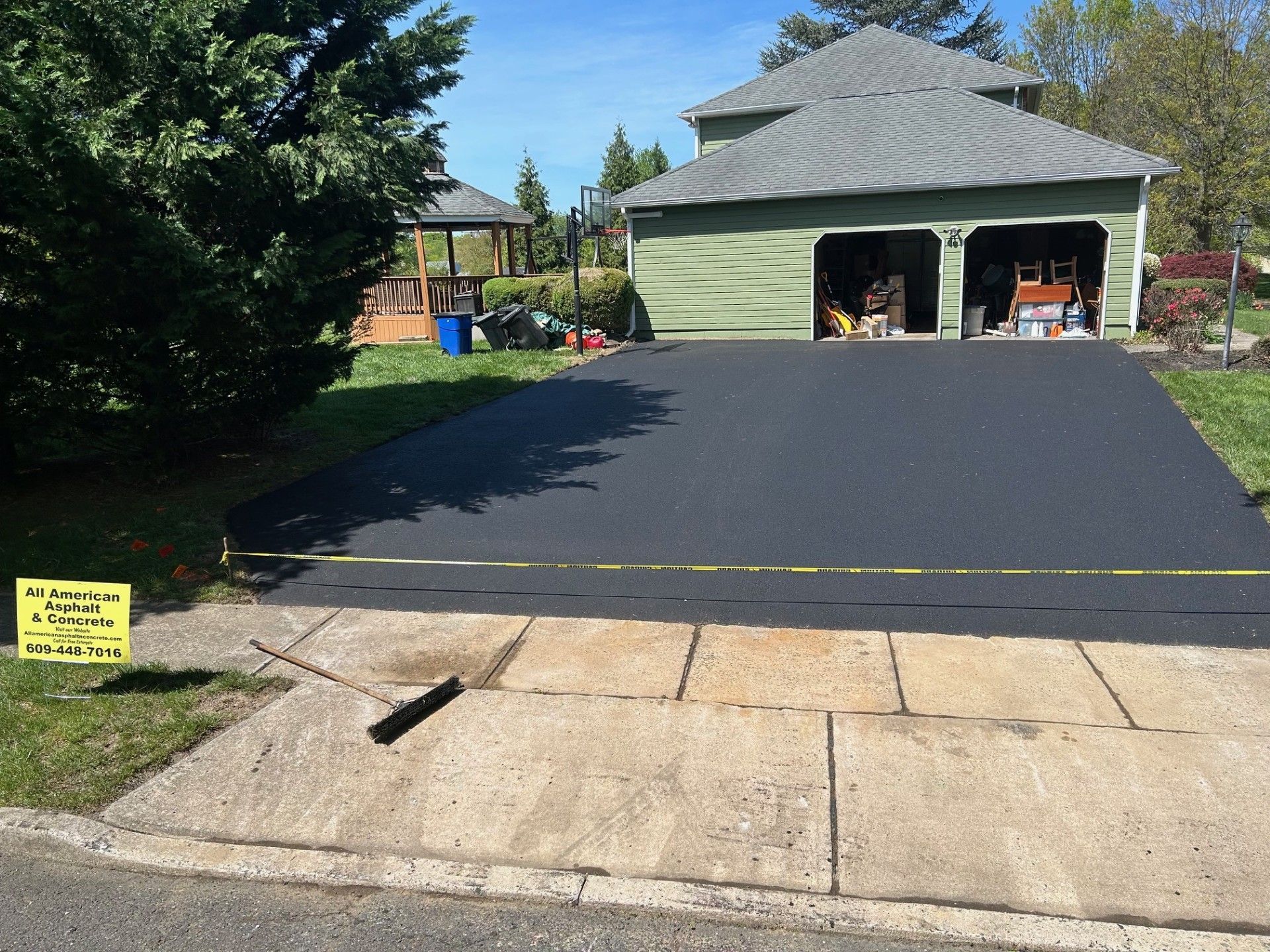A house with a large driveway and a sign that says no parking.