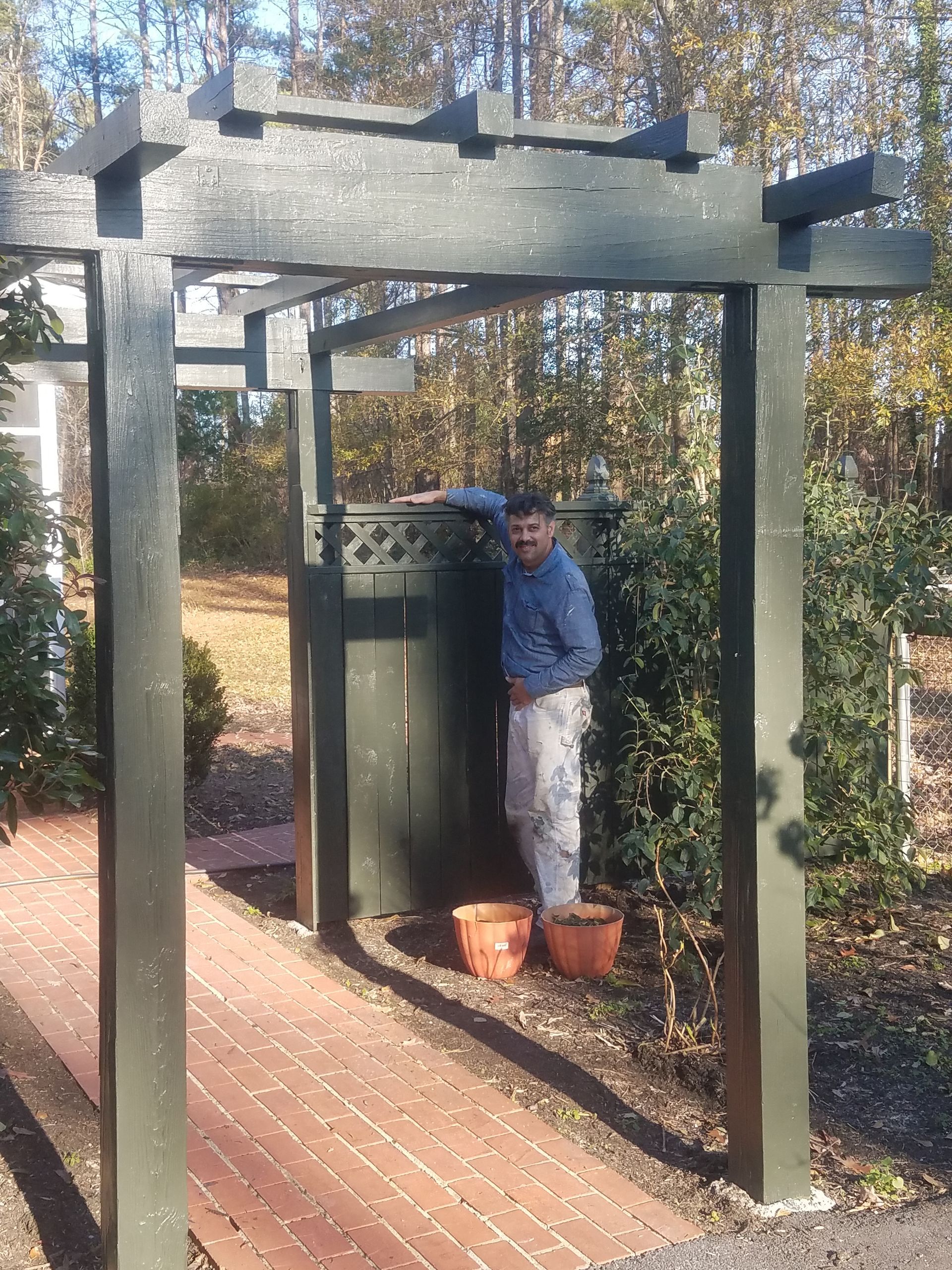 A room with a lot of boxes and a bed in it.
