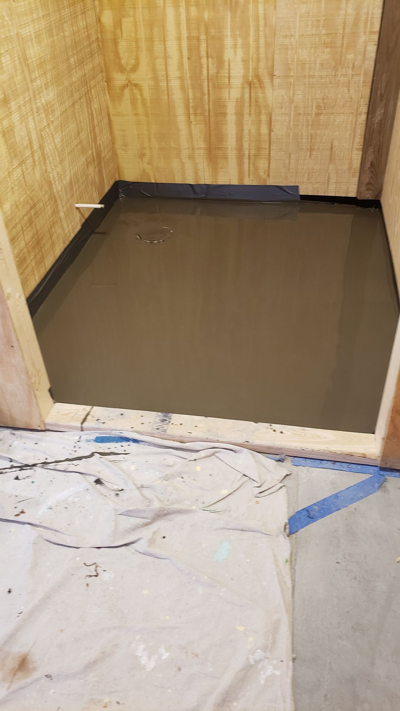 A room with hardwood floors and a white door.