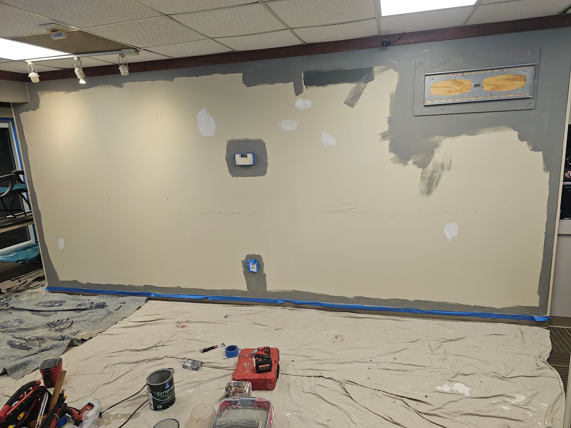 A wooden staircase is being built in a house.