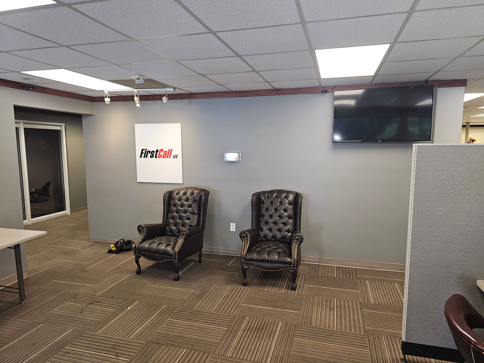 A man wearing a gas mask and goggles is standing in front of a mirror.