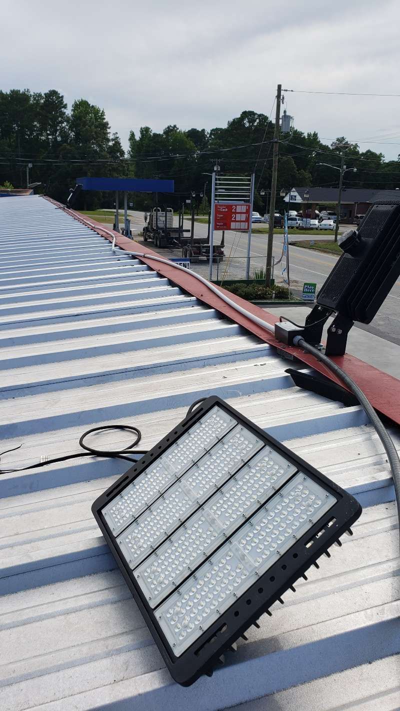 A light is sitting on top of a metal roof.